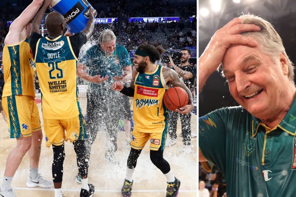 Tasmania JackJumpers coach Scott Roth gets an impromptu ice shower from his players after the NBL title win.