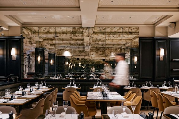 Batard has travertine floors and aged mirrors on the walls.