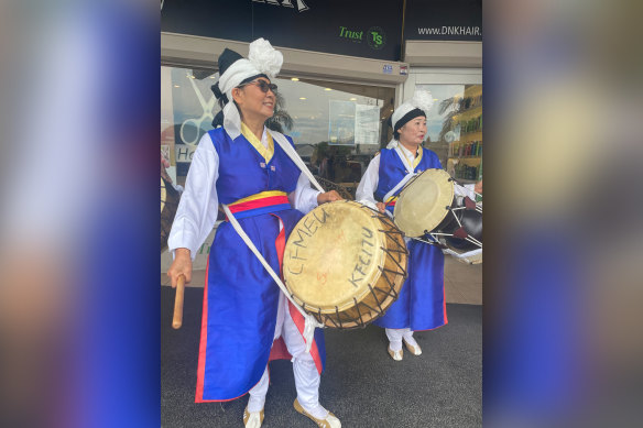 One of the musicians has a second-hand drum marked “CFMEU” and “KFCITU”.