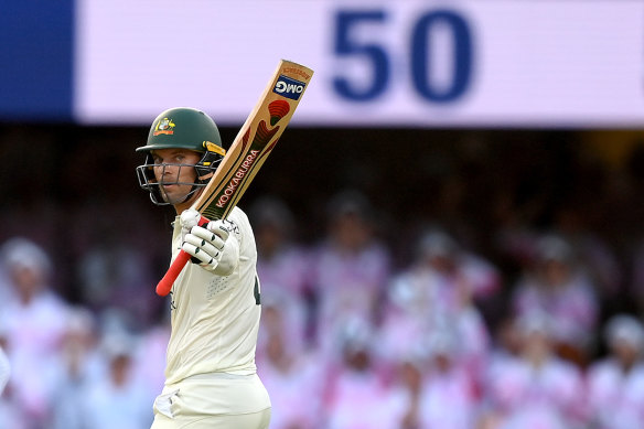 Alex Carey raises the Kookaburra.