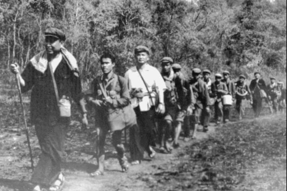 Khmer Rouge leader Pol Pot (left) seen leading Khmer Rouge troops in 1979.