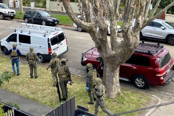 Police raid a luxury apartment in Goldsmith Street, Elwood.