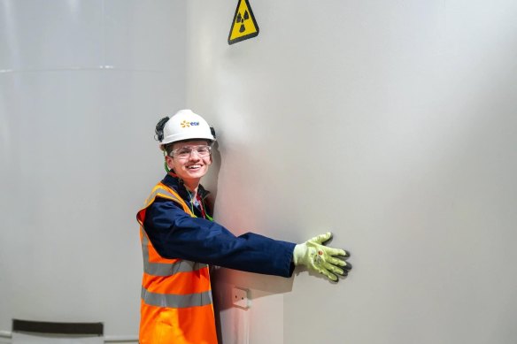 Will Shackel hugs a nuclear waste canister in a social media post. 