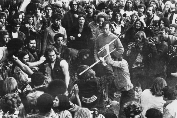 Hells Angels beat a fan with pool cues at the Altamont Free Concert, 6th December, 1969 in a still from the film Gimme Shelter.
