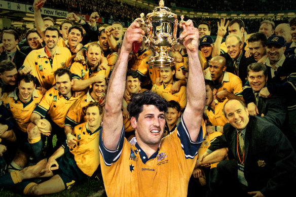 Glory days ... Former Wallabies captain John Eales raises The William Webb Ellis Trophy after the 1999 World Cup.