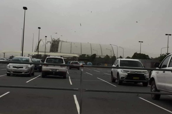 Part of the roof of a Canberra Airport hangar was ripped off during Friday's brief storm.