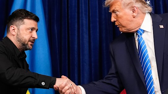 US President Donald Trump and Ukrainian President Volodymyr Zelensky shake hands at the start of a joint news conference following the meeting at Trump’s Mar-a-Lago.