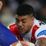 Dragons forward Hame Sele stops the Bulldogs’ Josh Curran before leaving the field.