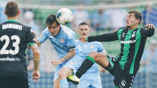Western United's Jerry Skotadis (right) battles with Melbourne City's Adrian Luna.