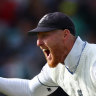 England’s Ben Stokes celebrates after taking a catch to dismiss Australia’s Pat Cummins.