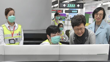 Chief Executive Carrie Lam, second from right, reviews the health surveillance measures at West Kowloon Station in Hong Kong.