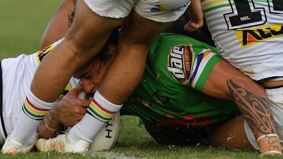 Close enough: Charnze Nicoll-Klokstad of the Raiders muscles his way across the line at McDonald Park in Wagga Wagga.
