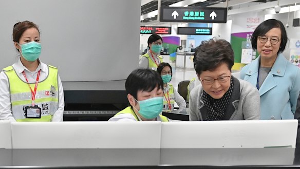 Chief Executive Carrie Lam, second from right, reviews the health surveillance measures at West Kowloon Station in Hong Kong.