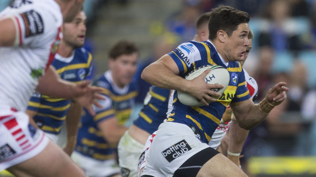 Nothing to lose: Mitchell Moses flies towards the try line against the Dragons.
