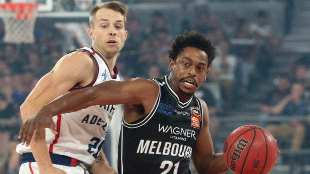 Adelaide's Nathan Sobey and Melbourne United's Casper Ware.