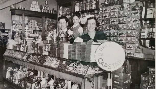 The lolly counter at the Paragon Café, Dalby, 1936. Milton Samios is behind the counter.