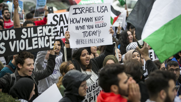 Hundreds march through the streets of downtown Chicago on Tuesday to protest the violence in Gaza.