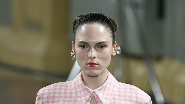 Dewy skin and bold lips at Emilia Wickstead.
