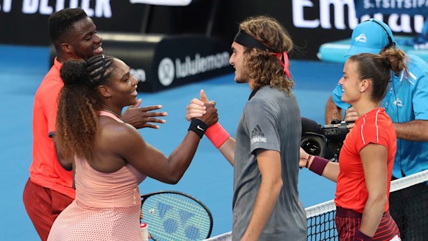 Mixed result: Stefanos Tsitsipass and Sakkari of Greece shake hands at the net after winning their mixed doubles match against Williams and Frances Tiafoe of the United States.