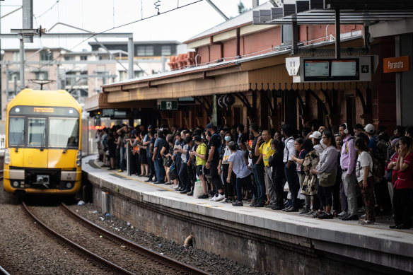 Commuters attempt to board trains at Parramatta station during delays across the network on Wednesday.