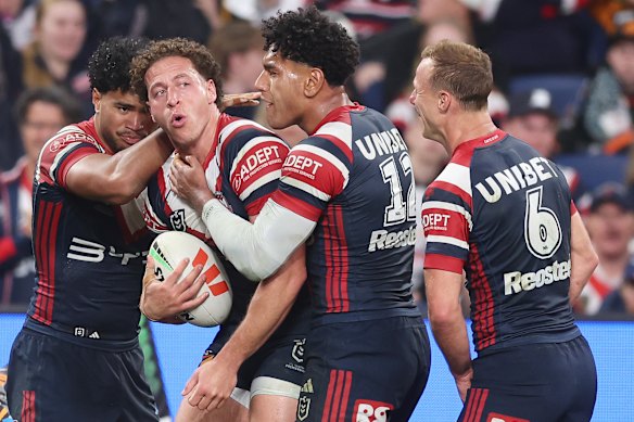 Mark Nawaqanitawase of the Roosters celebrates scoring a try during the round 25 NRL match between Sydney Roosters and Wests Tigers at Allianz Stadium