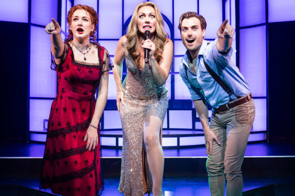 Georgina Hopson as Rose Dewitt Bukate (left), Marney McQueen as Celine Dion (centre) and Drew Weston as Jack Dawson (right) in the Australian production of cult hit musical, Titanique.