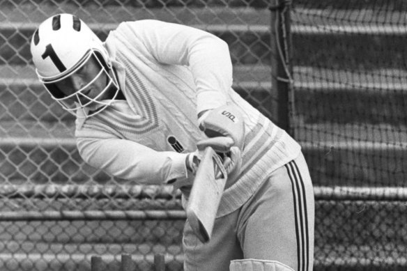 Dennis Amiss wears a helmet batting in the nets. The English batter was the first cricketer to adopt protective headgear.