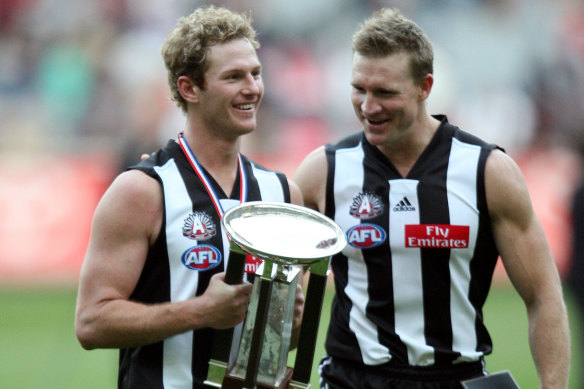 Ben Johnson with then teammate Nathan Buckley after an Anzac Day win in 2006.