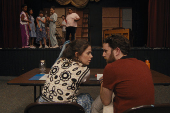 Molly Gordon and Ben Platt in Theater Camp play producers at a struggling theatre summer camp.