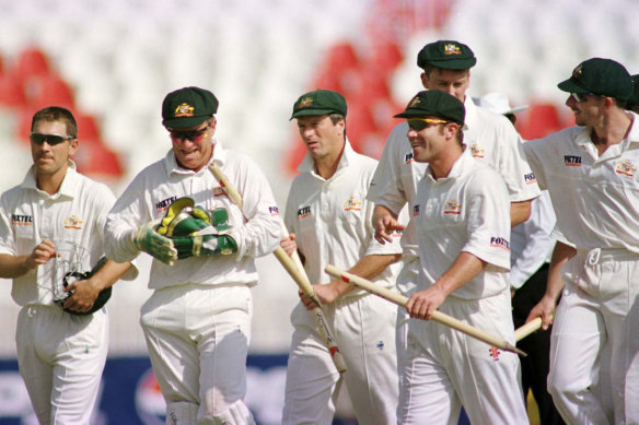 Steve Waugh and the Australian players walk off the field after defeating Pakistan at Rawalpindi stadium in 1998. 