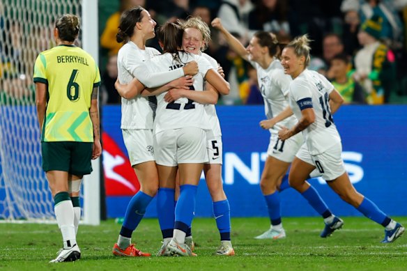 The Slovenian players come together after their goal beyond 90 minutes.