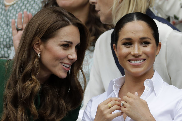 Britain’s Kate, Duchess of Cambridge, left, and Meghan, Duchess of Sussex in 2019.