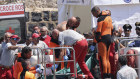 Italian firefighter divers bring ashore in a plastic bag the body of one of the victims of a shipwreck, in Porticello, Sicily. 