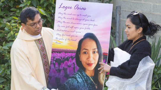 A picture of Logee Osias is placed at outside a church at a vigil for the mother of four held in Bendigo on Tuesday.