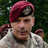 General Christopher Donahue (centre) greeting service members before the 2023 renaming of Fort Bragg in North Carolin...