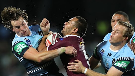 Phillip Sami is tackled.