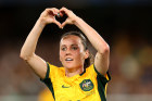 Hayley Raso makes a heart sign as the Matildas score against Uzbekistan.