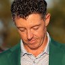Rory McIlroy buttons up the green blazer presented to the US Masters champion – his second in two years.