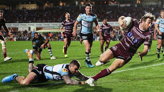 Last gasp: Brendan Elliot adds insult to injury for the Sharks.
