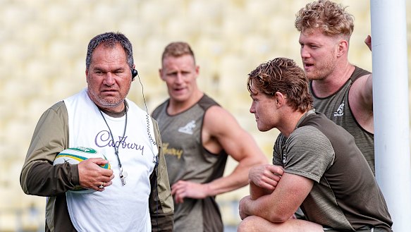 Dave Rennie speaks with captain Michael Hooper as Matt Philip watches on at training on Thursday. 