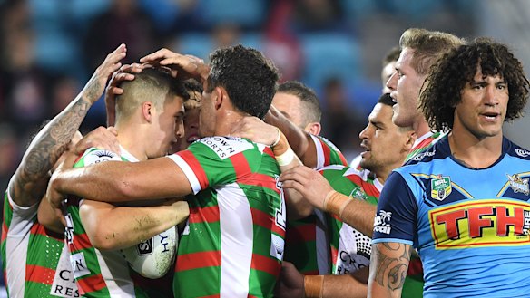 First of many: Souths Sydney's livewire rookie Adam Doueihi is congratulated after scoring his maiden NRL try.