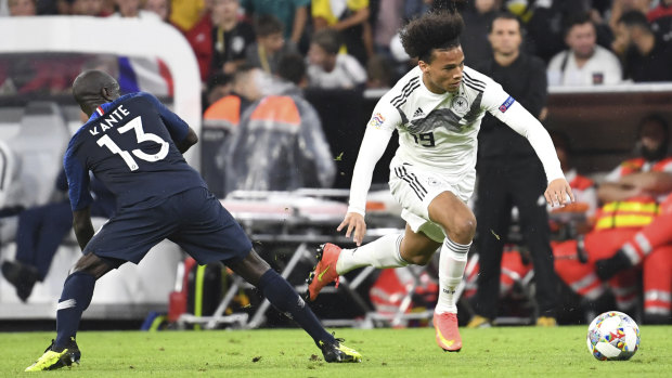 Stalemate: Germany's Leroy Sane (right) and France's N'Golo Kante challenge for the ball during their UEFA Nations League clash.