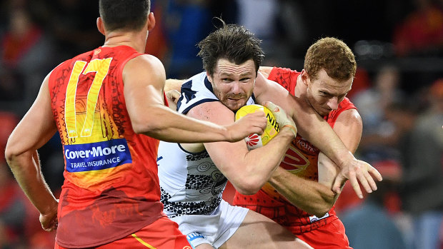 Cats star Patrick Dangerfield come under some heavy pressure against the Suns.