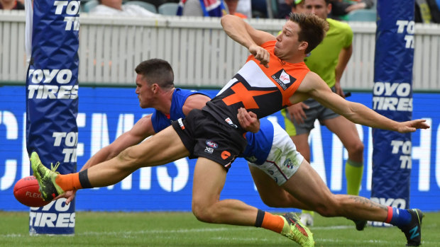 Goal sneak: Toby Greene kicks a goal during the round-one match against the Western Bulldogs at the UNSW Canberra Oval.