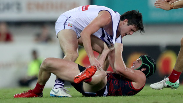 Brotherly shove: Andrew (top) and Angus Brayshaw go at it.