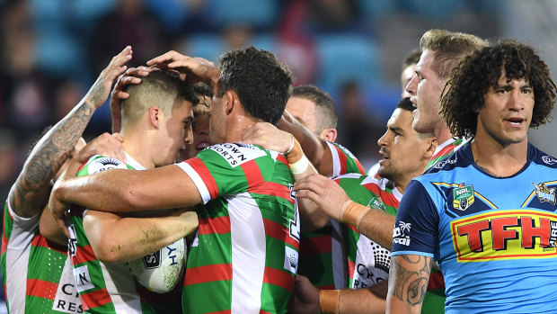 First of many: Souths Sydney's livewire rookie Adam Doueihi is congratulated after scoring his maiden NRL try.