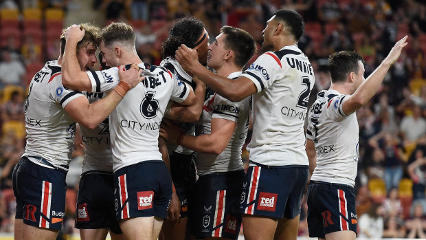 The Roosters celebrate a hard-fought victory over Brisbane on Friday night.