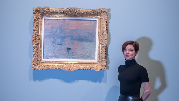 Marianne Mathieu of the Musée Marmottan Monet in Paris and curator for the NGA's Monet exhibition with Monet's Impression, Sunrise, on loan to a gallery outside of its Paris home for the first time. 