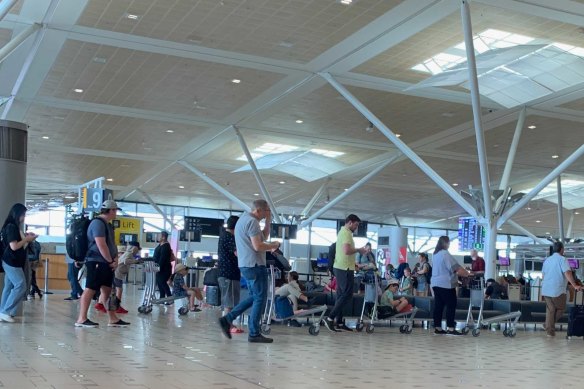 Passengers are experiencing lengthy delays at Brisbane Airport.