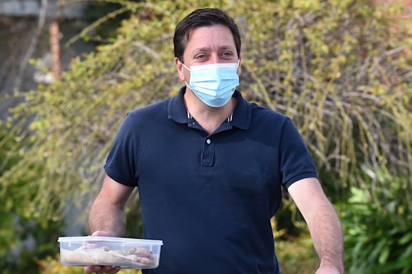 Matthew Guy delivers biscuits to the media on Monday morning.